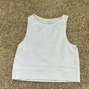 this is a white cropped tank top and it is a girls XS-S.